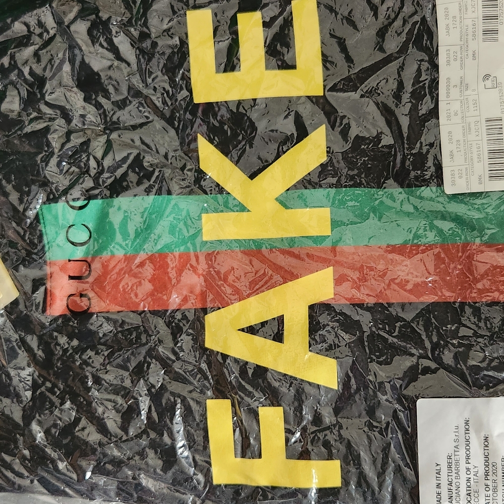 NwT $260 Gucci Black Tee with Yellow 'FAKE' and Stripes